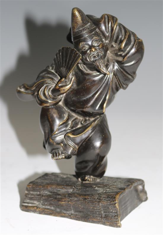 A Japanese bronze figure of Daikoku, 22cms